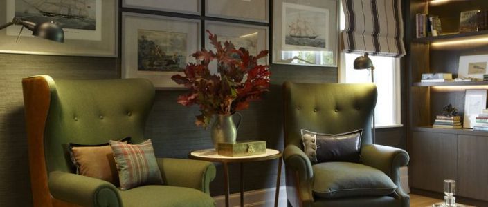 Rich red leaves combined with wooden furniture and green accents. Subtle Christmas Decoration.