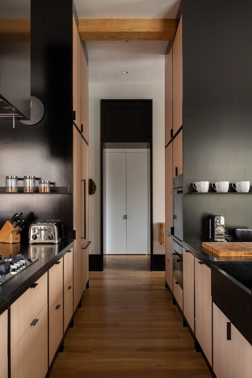 Black and Wooden Kitchen By Ashe Leandro