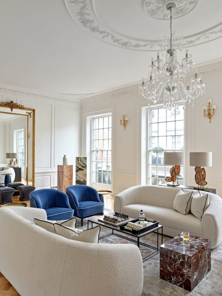 blue armchairs beige sofa bergman interiors marble side table
