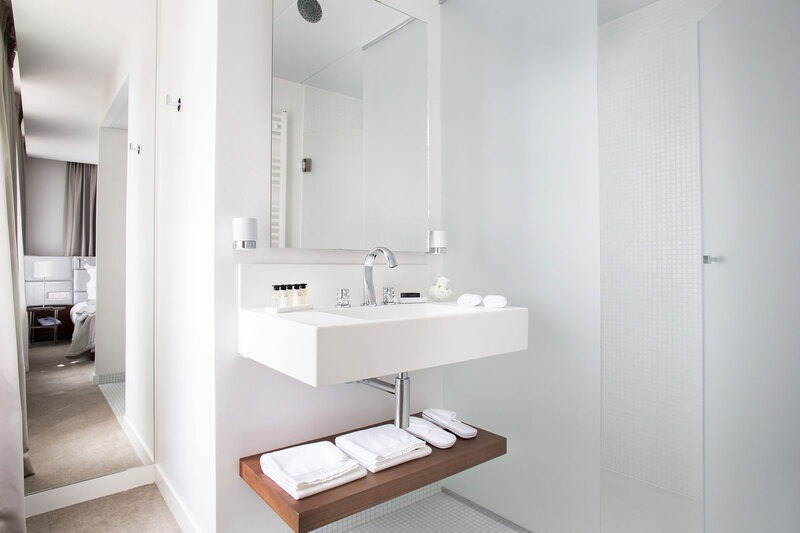 white bathroom washbasin designed by borella art design