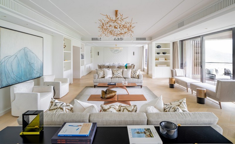 White toned family space with two sofas, two chaise longues and two armchairs